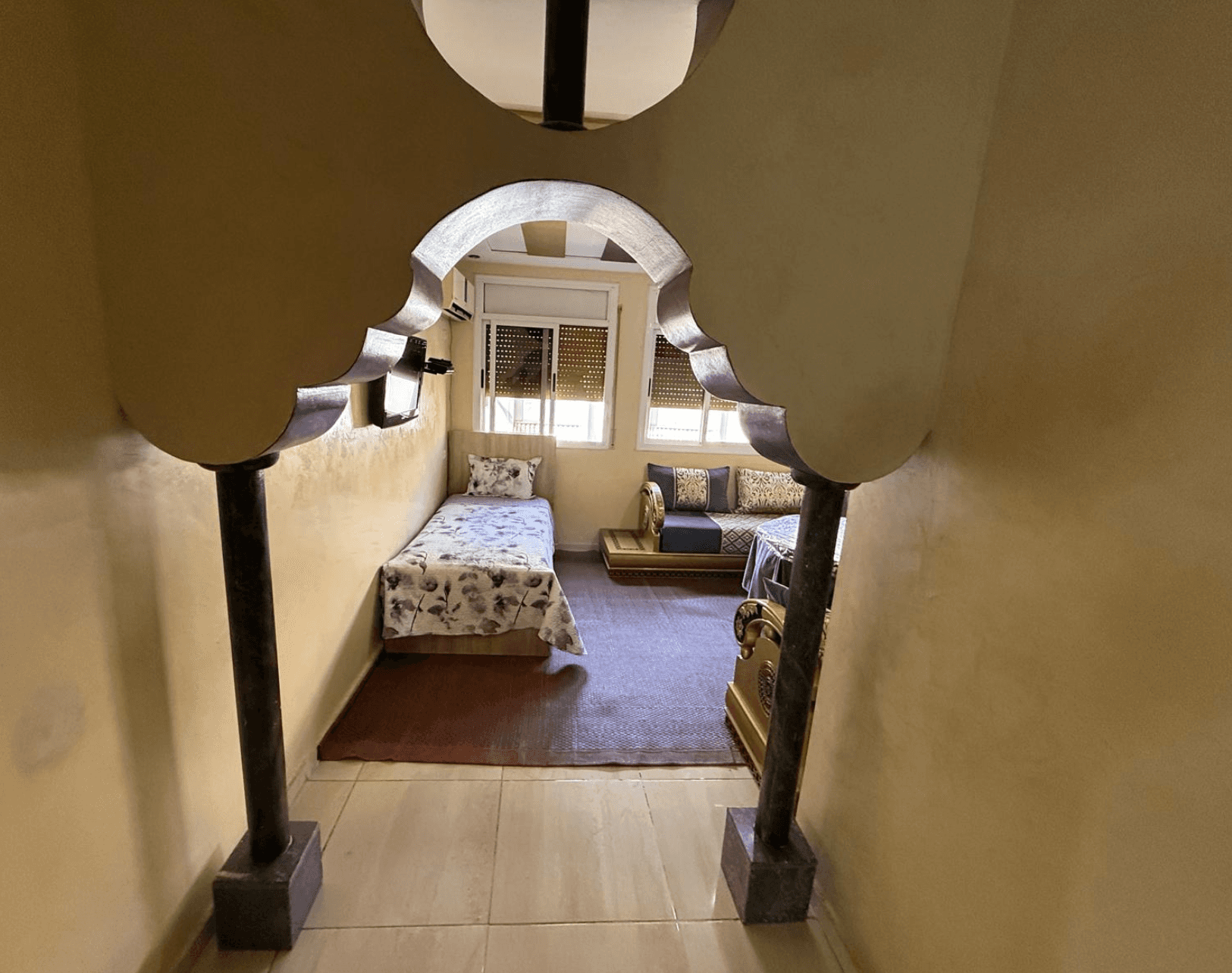 Carved arch leading into a bedroom
